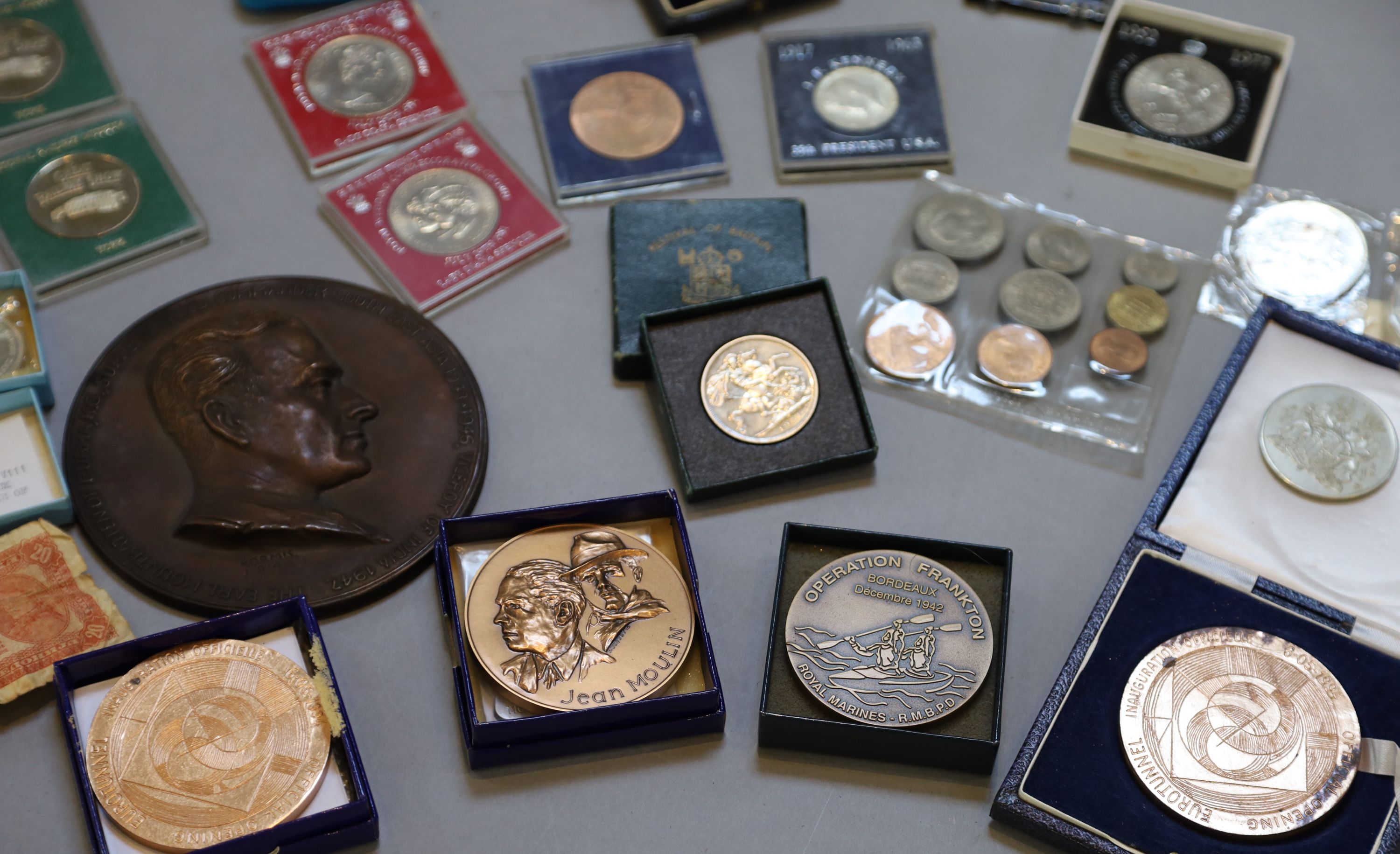 A collection of assorted coins and medallions